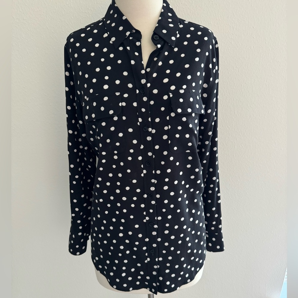 Polka dot shirt.